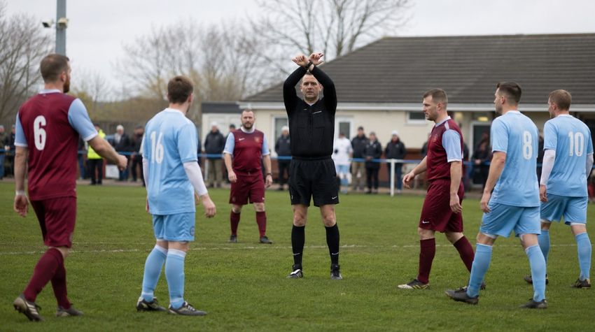 Grassroots football ref and players