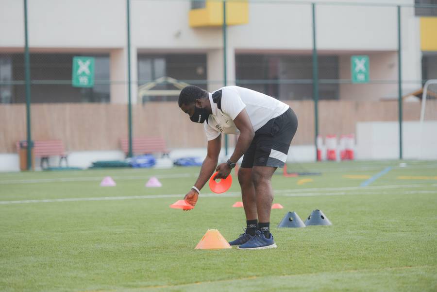 Grassroots football coach with cones