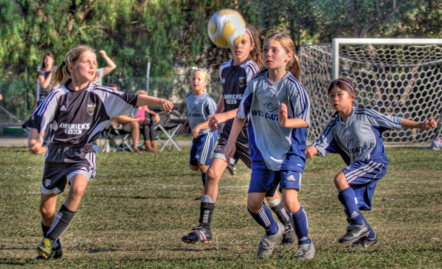 Young girls playing Grassroots football