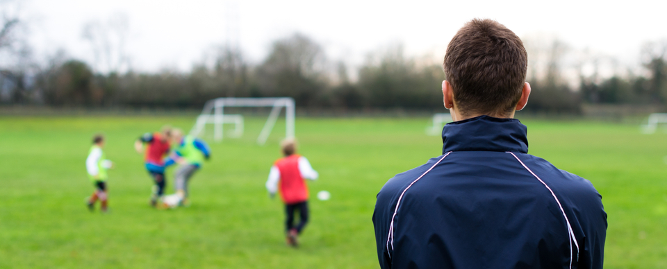 football coach watching match