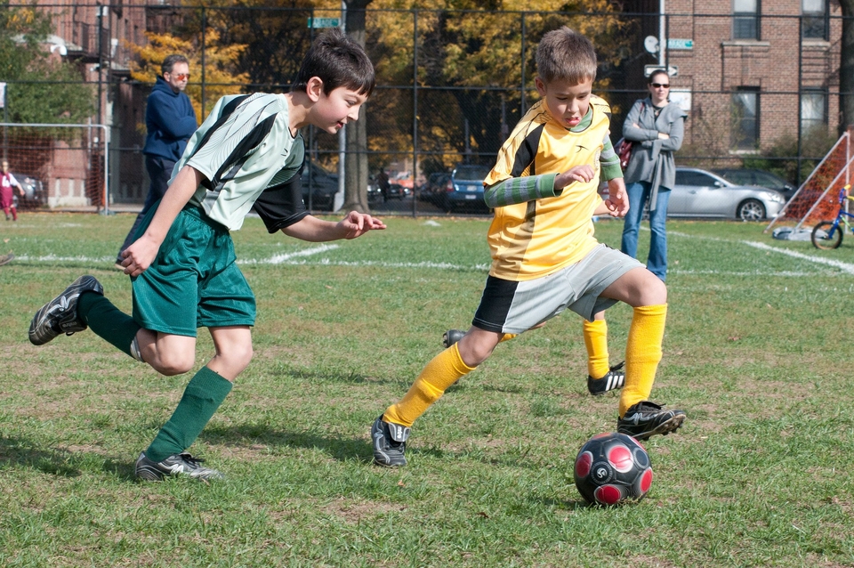 Kids playing football