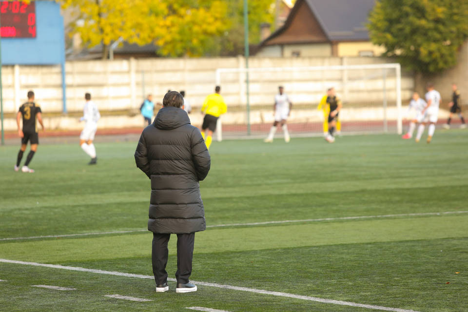 Coach watching match