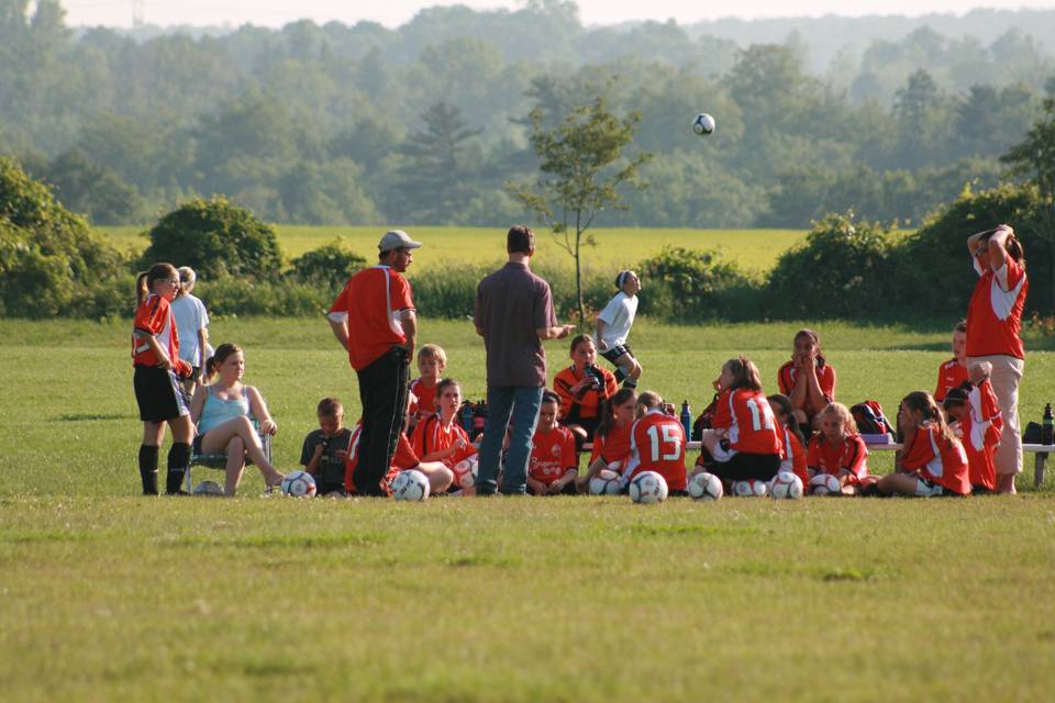 Grassroots coaches and players by pitch